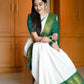 Pooja Special Lichi Silk Banarasi Saree With Green Kanjiwaram Figure.