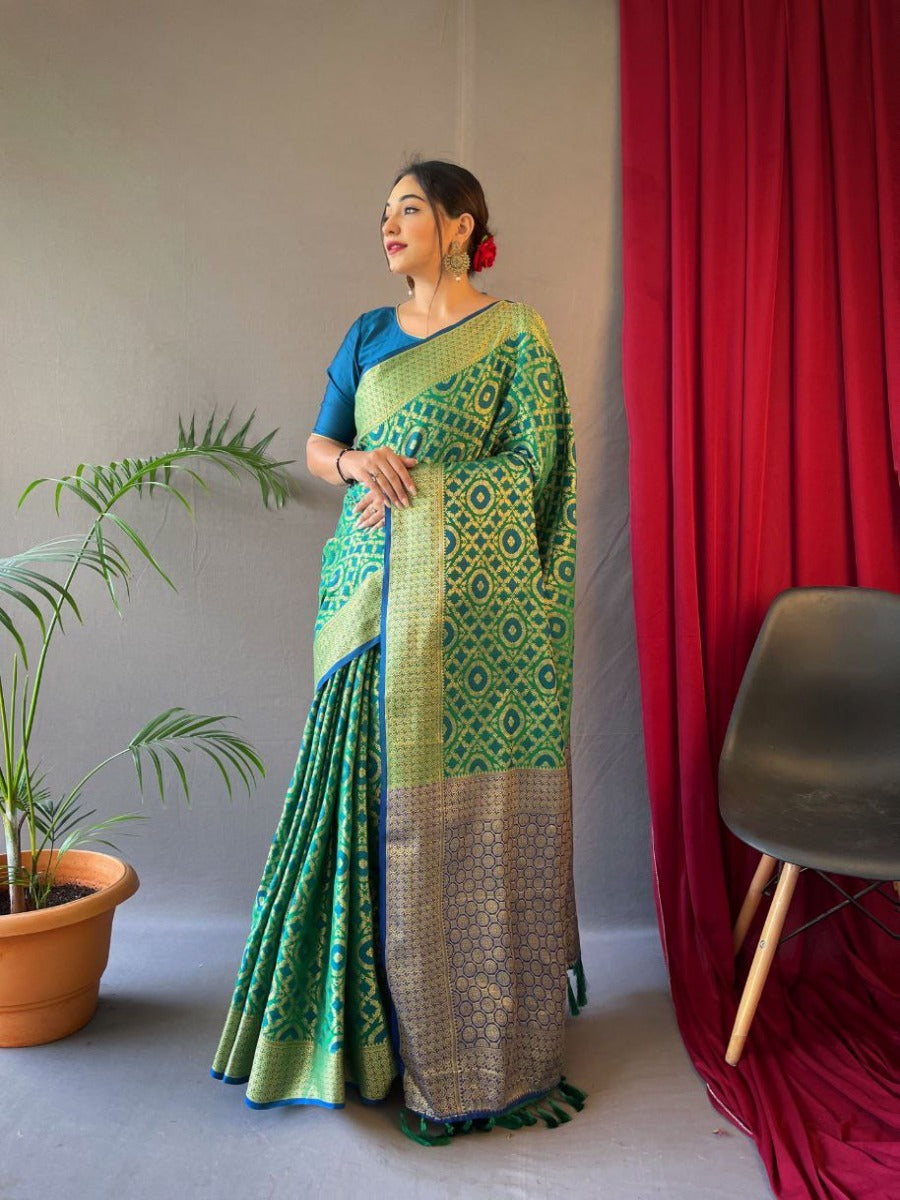 PURE PATOLA SILK SAREE WITH ALL OVER WEAVED DESIGN.